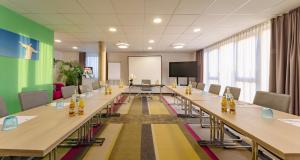 a large conference room with long tables and chairs at Best Western Hotel Bad Rappenau in Bad Rappenau