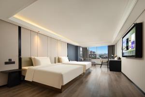 Μια τηλεόραση ή/και κέντρο ψυχαγωγίας στο Atour X Hotel Guangzhou Huangpu Nangang Wanda