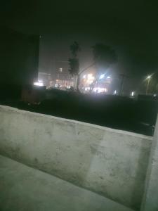 a view of a city at night with lights at Maruti Bhawan in Faizābād