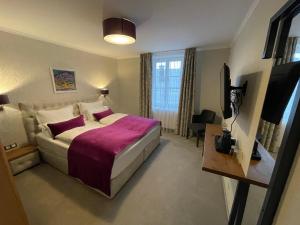 Łóżko lub łóżka w pokoju w obiekcie Hotel Radetzky