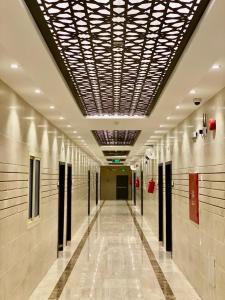 a hallway in a building with a ceiling at Zmroud Al-Morouj in Yanbu