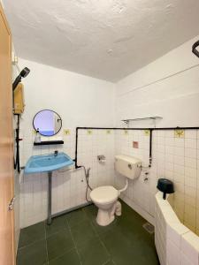a bathroom with a toilet and a sink at Muslim Homestay Teluk Intan ( Hotel Style Room ) by Mr Homestay in Teluk Intan