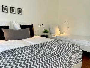 Ένα ή περισσότερα κρεβάτια σε δωμάτιο στο 2-Zi. Apartment 42 qm, an der Friedrichsau/Messe