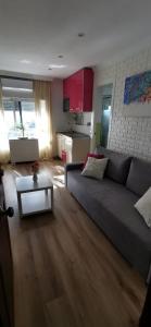a living room with a couch and a table at Estudio reformado primera linea playa in Sitio de Calahonda