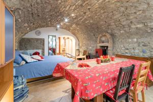 a bedroom with a bed and a table in a room at la taverna da Irene in Roe