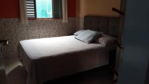 Postel nebo postele na pokoji v ubytování CASA TEMPORADA PERUIBE