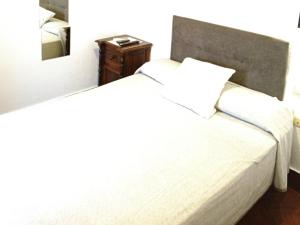Posteľ alebo postele v izbe v ubytovaní Hostal Cuzco