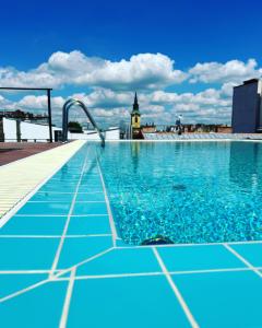 a swimming pool on the roof of a building at K40 Boutique Apartment in the City Center in Budapest