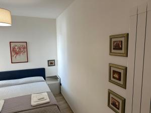 Ένα ή περισσότερα κρεβάτια σε δωμάτιο στο La Casa Di Tina