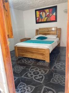 Postel nebo postele na pokoji v ubytování Hostal Vista Hermosa