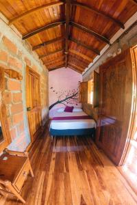 Postel nebo postele na pokoji v ubytování Hostal Vista Hermosa