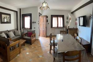 a living room with a couch and a table at Il Rifugio di Carmine in Castel di Sangro +10 photos