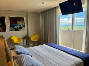 מיטה או מיטות בחדר ב-Paiva Home Stay - Beira Mar - Flat