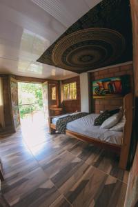 Postel nebo postele na pokoji v ubytování Hostal Vista Hermosa