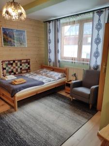 Posteľ alebo postele v izbe v ubytovaní Apartamenty u drwala