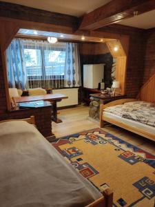Posteľ alebo postele v izbe v ubytovaní Apartamenty u drwala