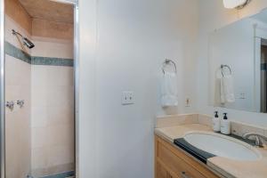 a bathroom with a sink and a shower at Ajax Loft apts in Telluride +25 photos