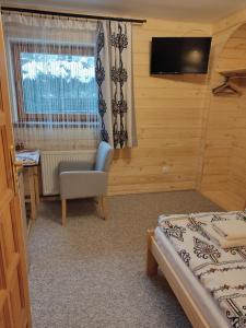 Posteľ alebo postele v izbe v ubytovaní Apartamenty u drwala