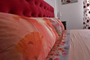 Postel nebo postele na pokoji v ubytování LA CASA DELLA MAMMINA