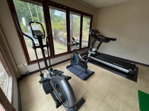 a room with a gym with a treadmill and a bike at Kohchang Privilege in Ko Chang