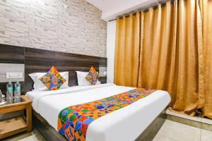 a hotel room with two beds in a room at HOTEL DHANUA PALACE in Chandīgarh