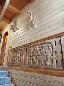 a stone relief on the wall of a building at Apartamenty u drwala in Zakopane