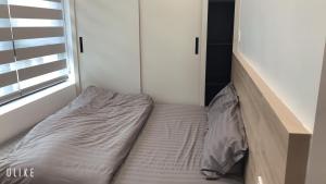 מיטה או מיטות בחדר ב-MinA Apartment - Vinhome Marina Hải Phòng