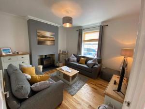 Et opholdsområde på Dexters Den - Sea views, yards from Beach