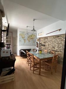 a dining room with a table and chairs at Albergue Mayor in Sarria