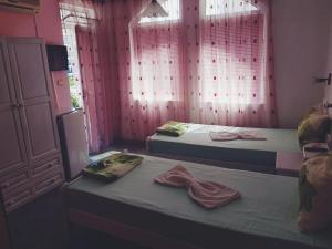 Postel nebo postele na pokoji v ubytování Guesthouse Flora