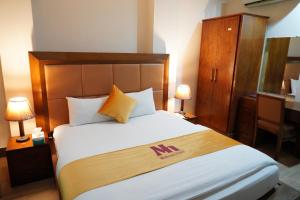 Postel nebo postele na pokoji v ubytování Midtwon Hotel Islamabad