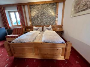 Łóżko lub łóżka w pokoju w obiekcie Hotel Garni Gafluna