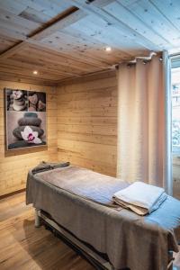 Postel nebo postele na pokoji v ubytování Hotel Les Mélèzes