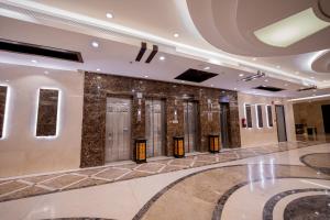 a lobby with a row of elevators in a building at فندق سنود المروة in Mecca