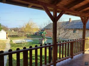 a view from the porch of a house with a playground at Schönes Ferienhaus mit Pool in Balatonújlak