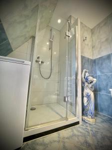 a shower in a bathroom with a glass shower stall at Casa Jungle Glanz Deluxe in Sigmaringen