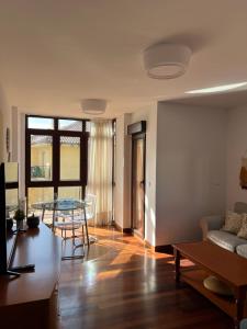 a living room with a couch and a table at LA TERRAZA in Comillas