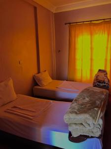 Postel nebo postele na pokoji v ubytování SEVEN DAYS HOTEL