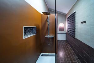 a bathroom with a shower with a glass door at Šanić Apartments 543/a in Lopar