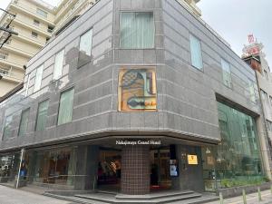 a building with a window on the side of it at Nakajimaya Grand Hotel in Shizuoka