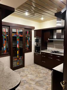 a kitchen with stained glass windows in a kitchen at Home in Yerevan