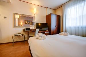 Postel nebo postele na pokoji v ubytování Hotel Europa + 37 fotografií
