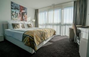 Postel nebo postele na pokoji v ubytování Hotel Swiss Star + 37 fotografií