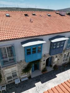 an overhead view of a house with an orange roof at Mavi Konak Alaçatı in Alaçatı +9 photos