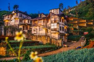 a large house on the side of a hill at GlenfallsRest in Nuwara Eliya