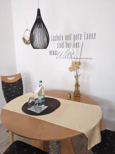 a dining room table with a table cloth on it at Ferienwohnung Schlossblick in Eisfeld