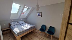 Un pat sau paturi într-o cameră la Letnia