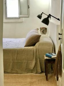 A bed or beds in a room at Trullo Falco