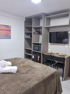 En eller flere senge i et værelse på Paradise Beach Flats