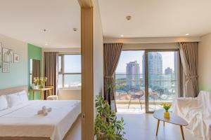 a bedroom with a bed and a large window at The Sóng Luxury Condotel Vũng Tàu - Dori's House in Vung Tau +165 photos
